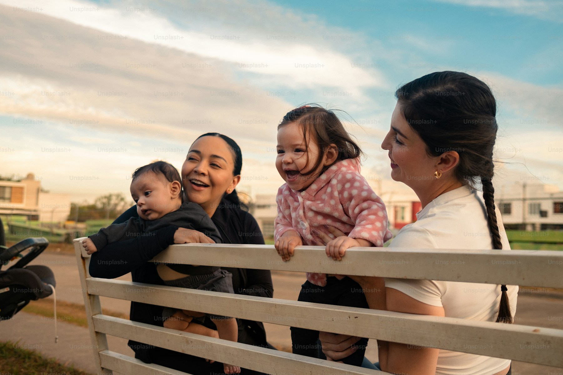 Lesbian couple with their children outdoors